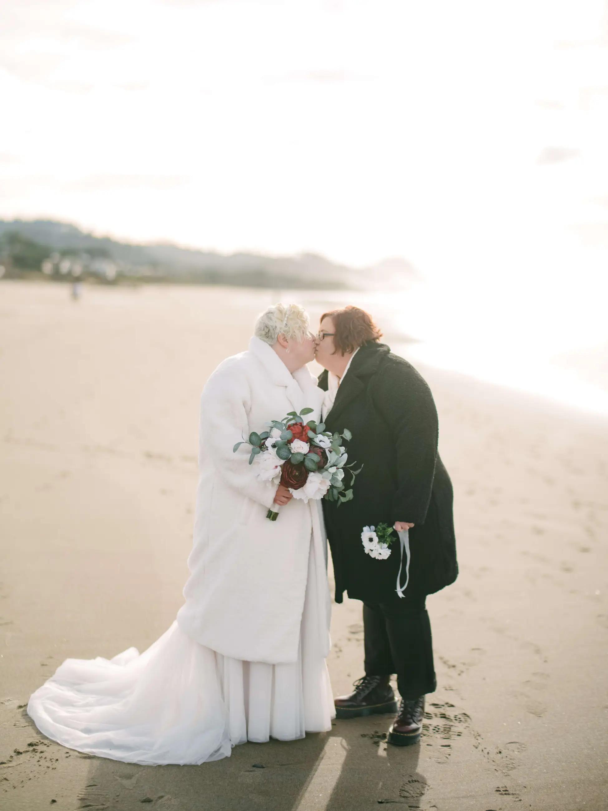 Two brides kissing on Wedding Day