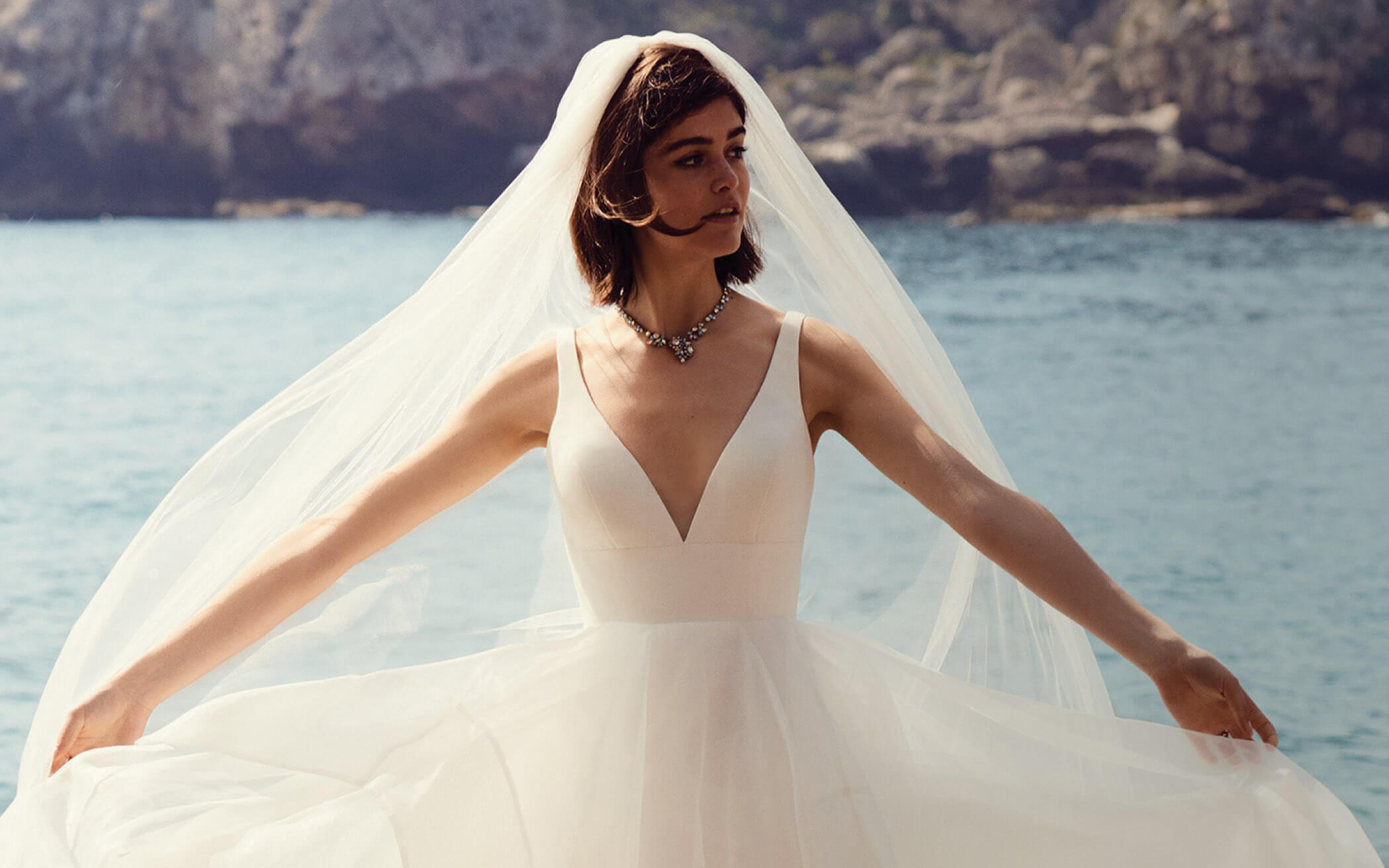 Bride on rocky seacoast