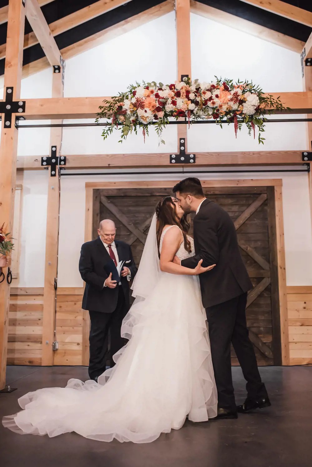 bride and groom first kiss