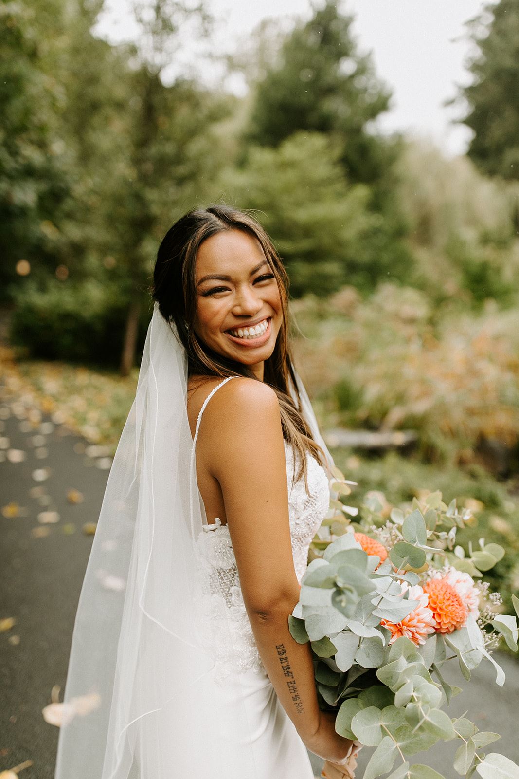 bride in wedding dress with veil from charlotte's weddings in portland oregon