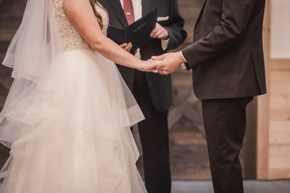 bride and groom holding hands