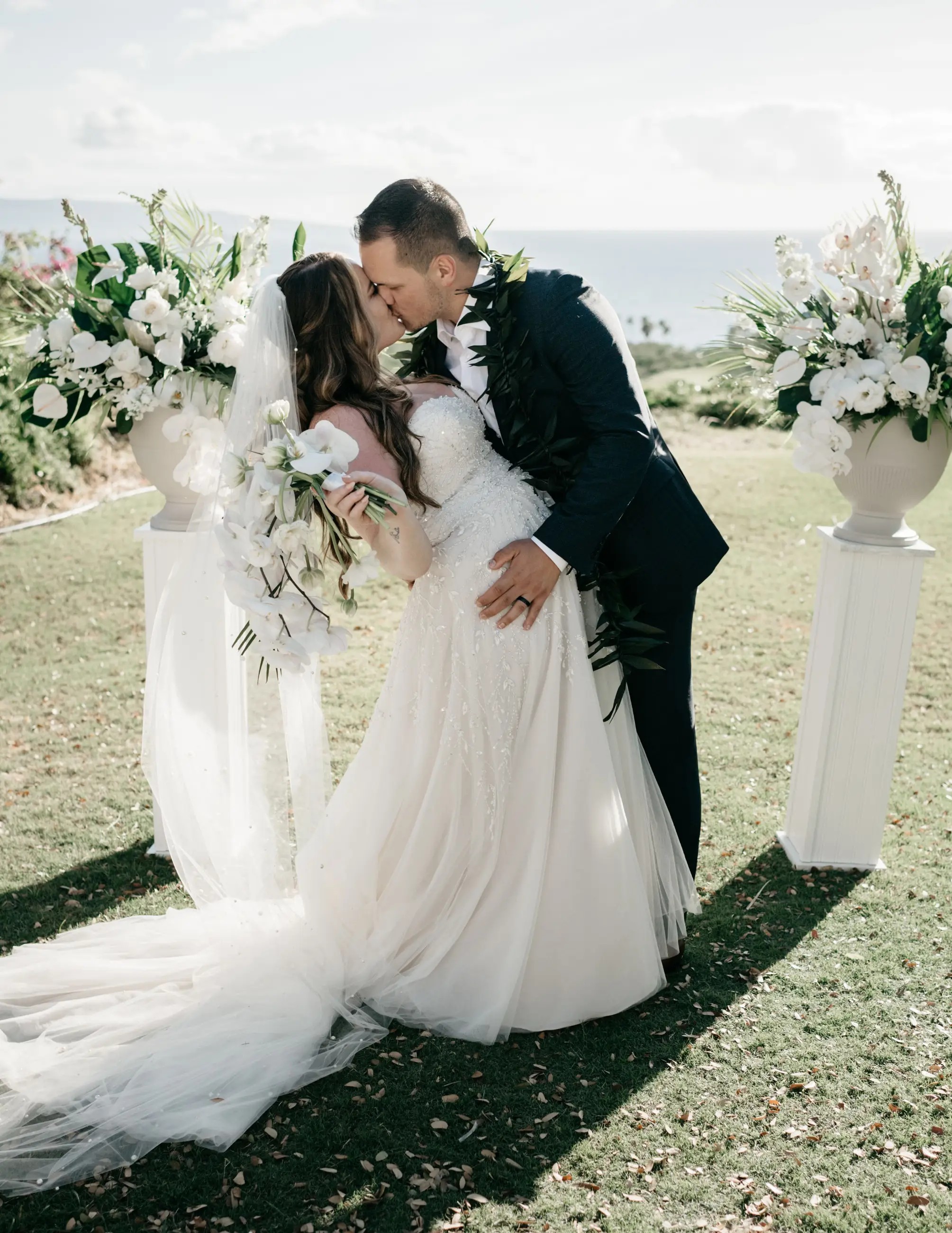 Bride and groom kissing on wedding day