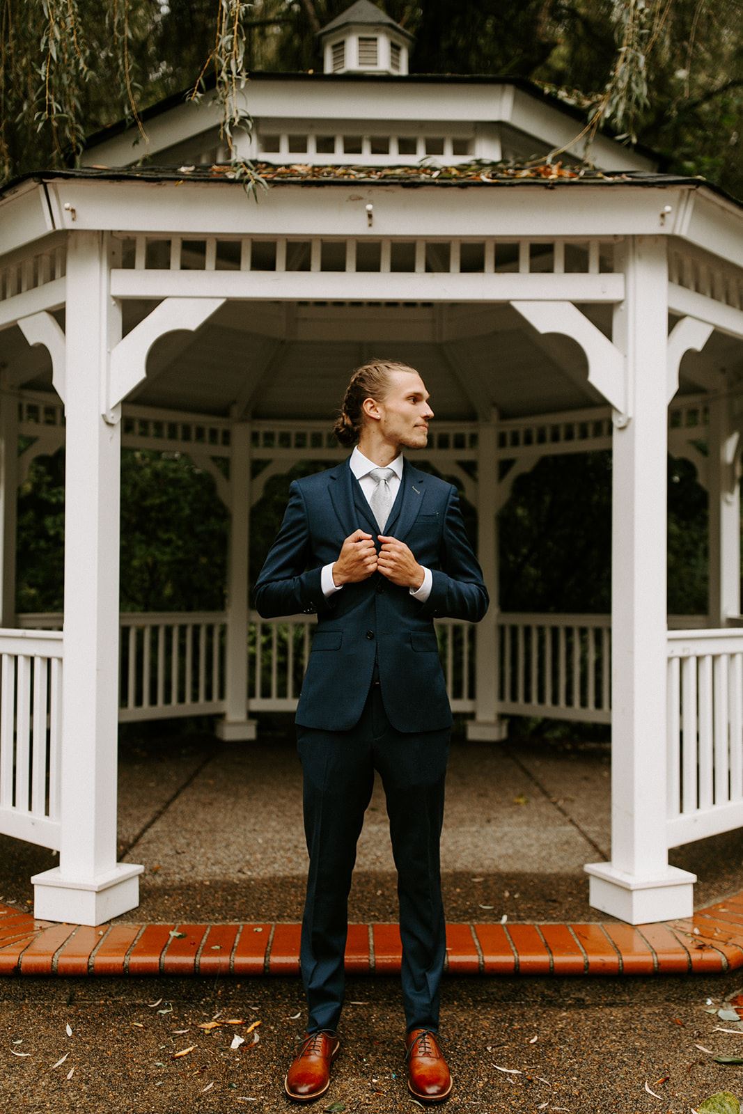 groom posing for photo