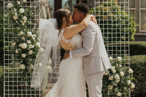 bride and groom first kiss