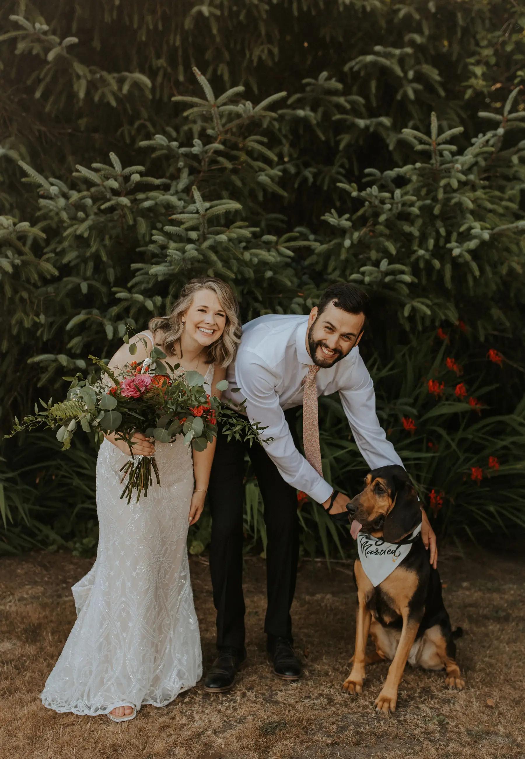 Photo of couple at wedding with dog